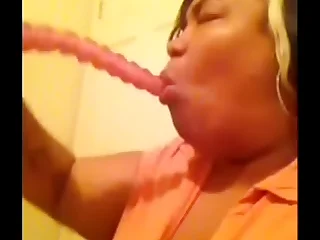 Madame Butterfly aka Gigi Starr deepthroating a 10 inch dildo